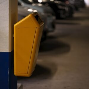 A parking garage filled with lots of parked cars